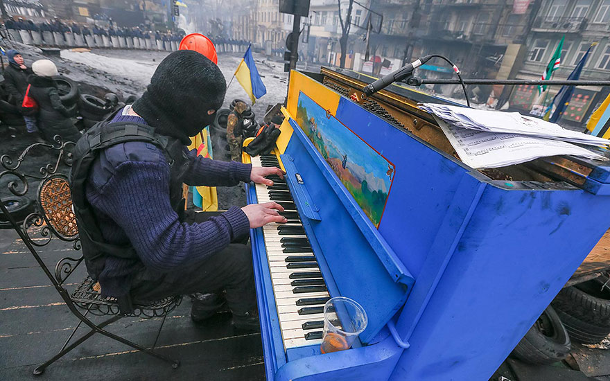 Ukrainian Protester Plays Piano On A Barricade In Front Of The Riot Police Line (Kiev, Ukraine, 2014)