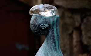 Sculpture Of Giant Raindrop Resting On Man's Face In Ukraine