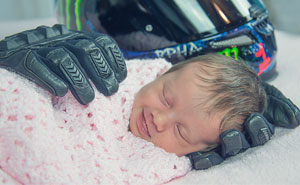 Baby Smiling After Being Wrapped In Her Late Father’s Motorcycle Gloves