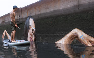 Artist Paints NEW Stunning Seaside Murals While Balancing On A Paddleboard