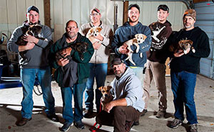 Stray Dog Leads Partying Bachelor Guys To Her 7 Newborns, They Adopt Them All