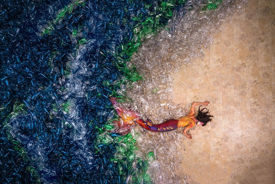 Photographer Drowns Mermaids In 10,000 Plastic Bottles To Raise Awareness About Pollution