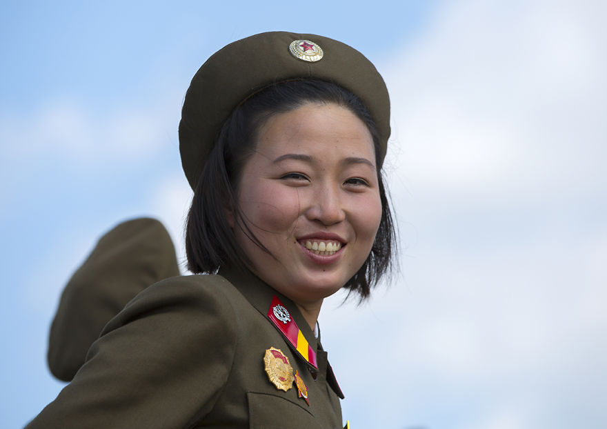 Smiling Female Soldier In Tower Of The Juche Idea, Pyongyang, North Korea
