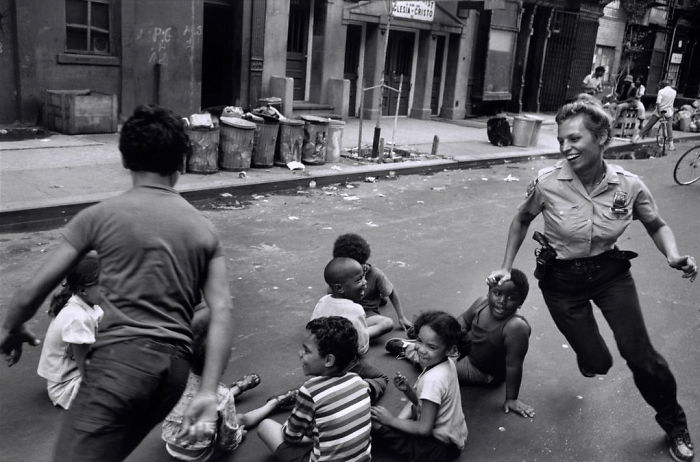 Police Officer Playing With Children, Harlem, 1978