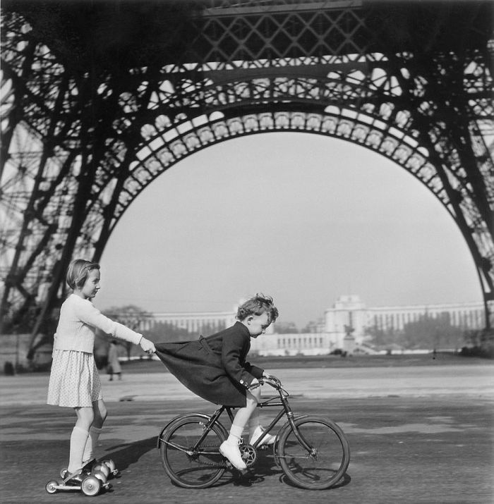 Children Playing In Paris Under The Eiffel Tower