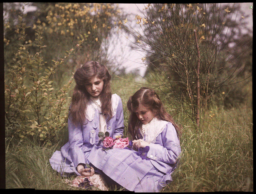 Sisters Sitting In A Garden Tying Roses Together, 1911