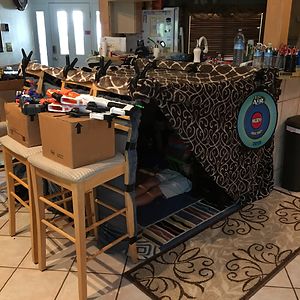 Kid Forts Have Come A Long Way... This One Has A Weapons Cache, A Fan, Carpet, Furniture, Interior Lighting And Wall Art.