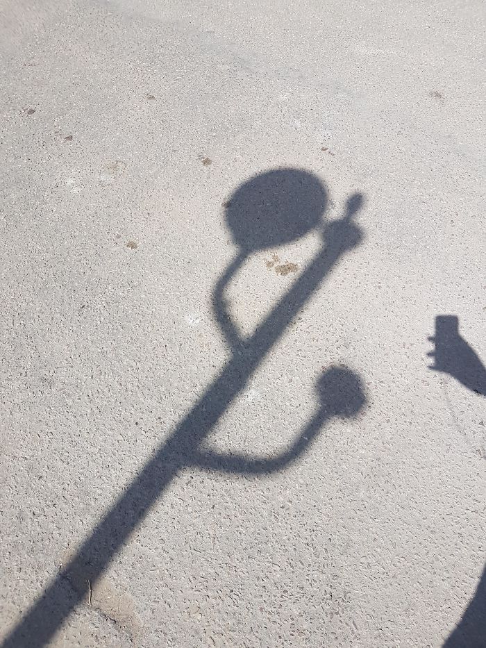 This Light Pole Shadow Looks Like A USB Logo