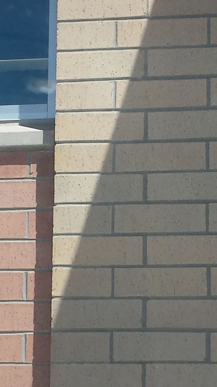 These Bricks Look Slightly Shifted At The Edge Of The Shadow