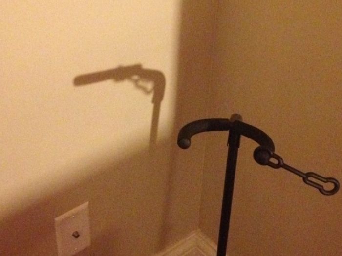 The Shadow Of My Guitar Stand Looks Sort Of Like An 18th-Century Gun