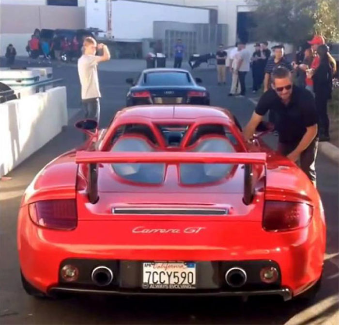 Paul Walker Climbing Into The Car That Eventually Crashed, Taking His And The Driver’s Lives Back In 2013