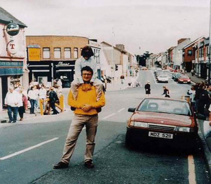 The Omagh Bombing. The Red Car In This Photograph Contained A Bomb That Killed 29 People And Injured Some 220 Others. The Man And Child Both Survived, The Photographer Didn't