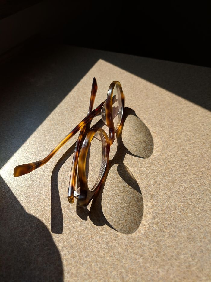 The Shadow Of These Eyeglasses Looks Like A Different Style Of Eyeglasses