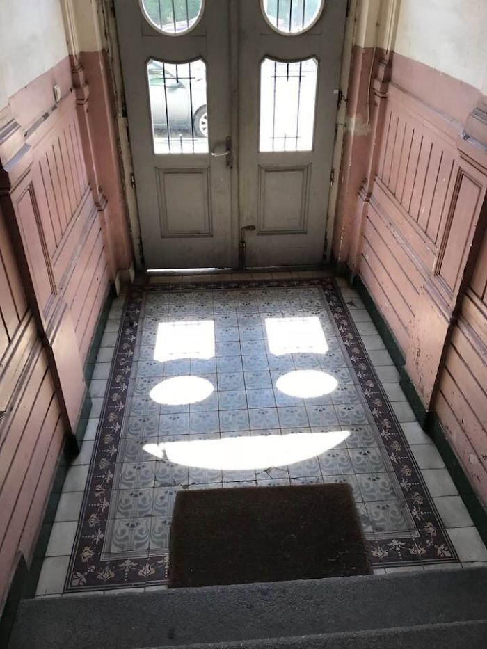 Windows On The Entrance Of My Apartment Creating A Smiley Face In Sunlight