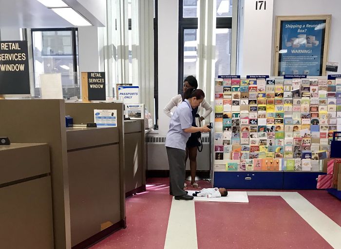 USPS Worker Taking Passport Picture For The Baby