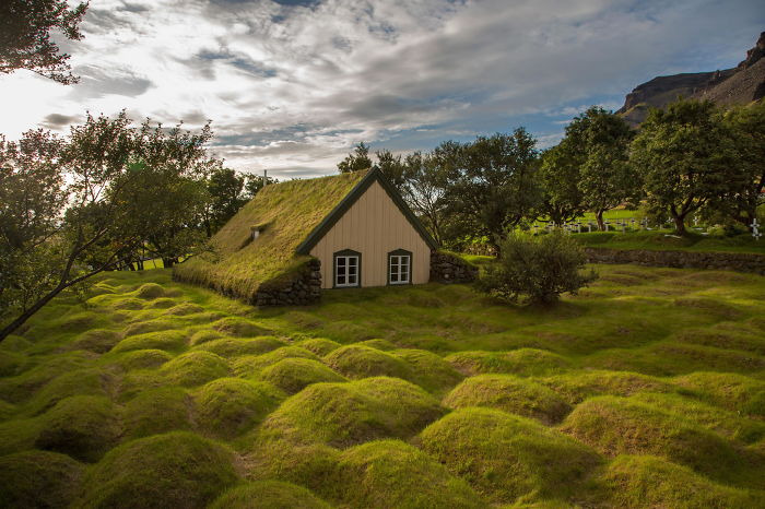 Hofskirkja, Iceland. The Humps On The Grass Are Ancient Graves