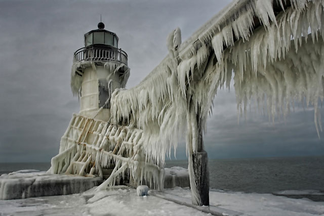 Frozen Lighthouses Caught In Winter’s Icy Grip On Lake Michigan Shore
