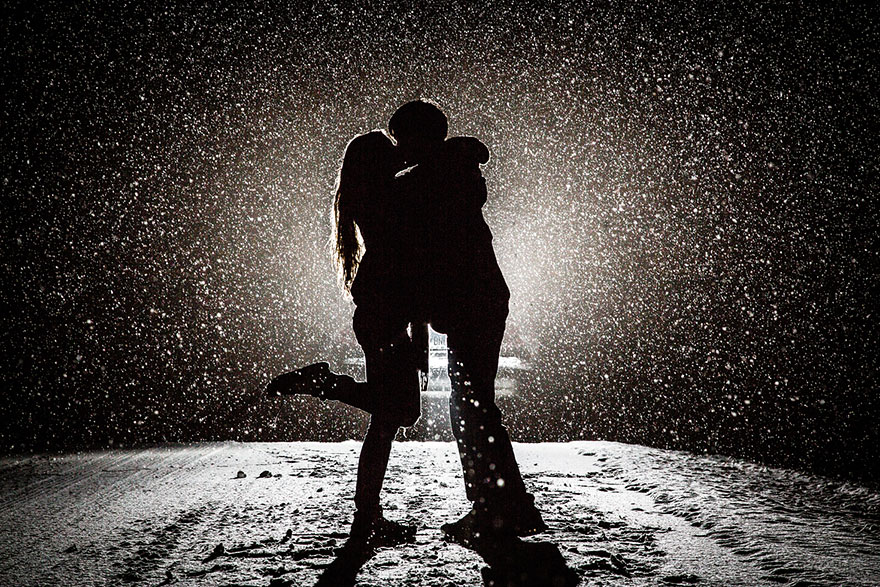 the pair kissing under the snow