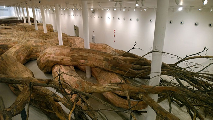 Artist Uses Repurposed Wood To Build Giant Root-like Tunnels You Can Explore From The Inside
