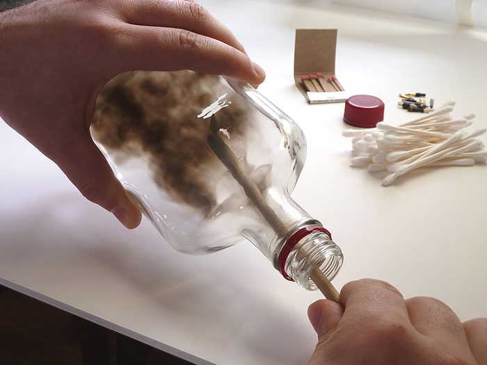 Artist Fills Bottles With Smoke And Brushes It Away To Create Beautiful Art