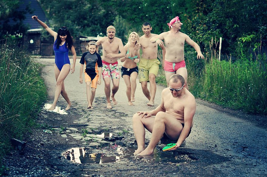 Friends Take Funny Pothole Photos To Draw Government's Attention To Poor Road Conditions In Kaunas