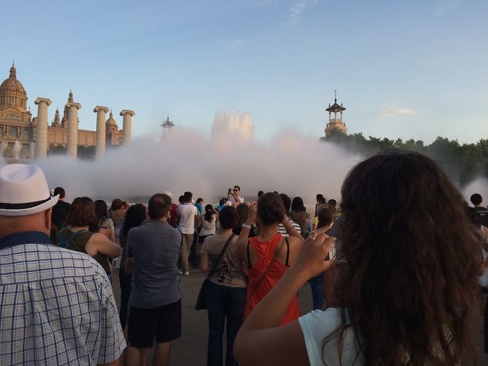 People Watching The Dancing Fountains In Barcelona