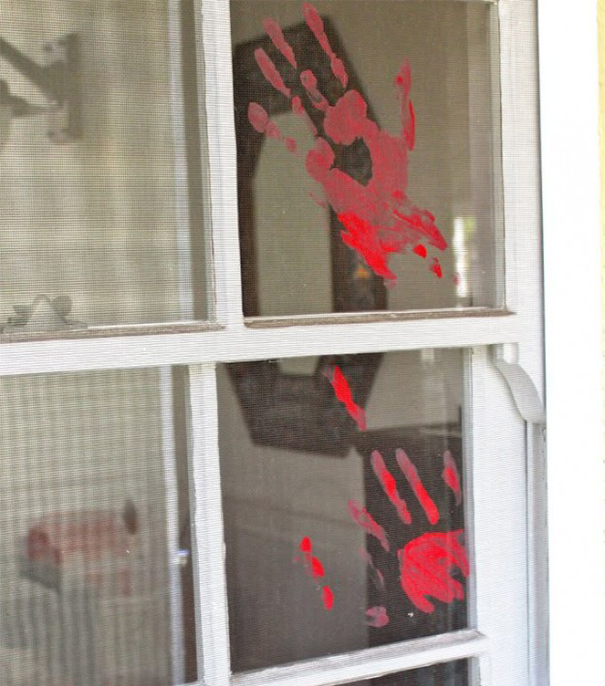 Bloody Handprint On A Window
