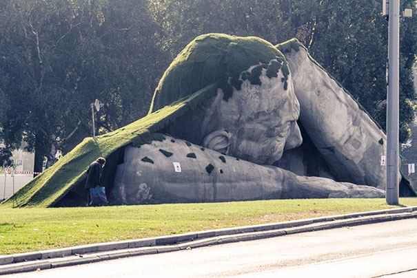 A Giant Sculpture Crawls Out Of The Ground In Public Square Of Budapest
