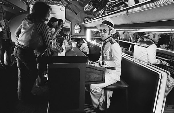 Elton John At The Piano Bar Aboard His Private Plane, 1976