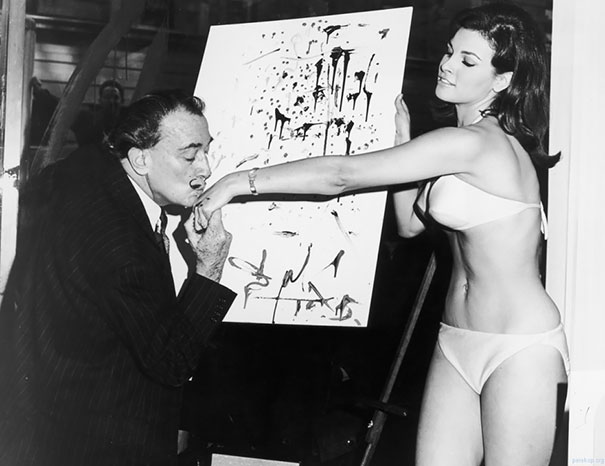 Salvador Dali Kisses The Hand Of Raquel Welch After Finishing His Famous Portrait Of Her, 1965