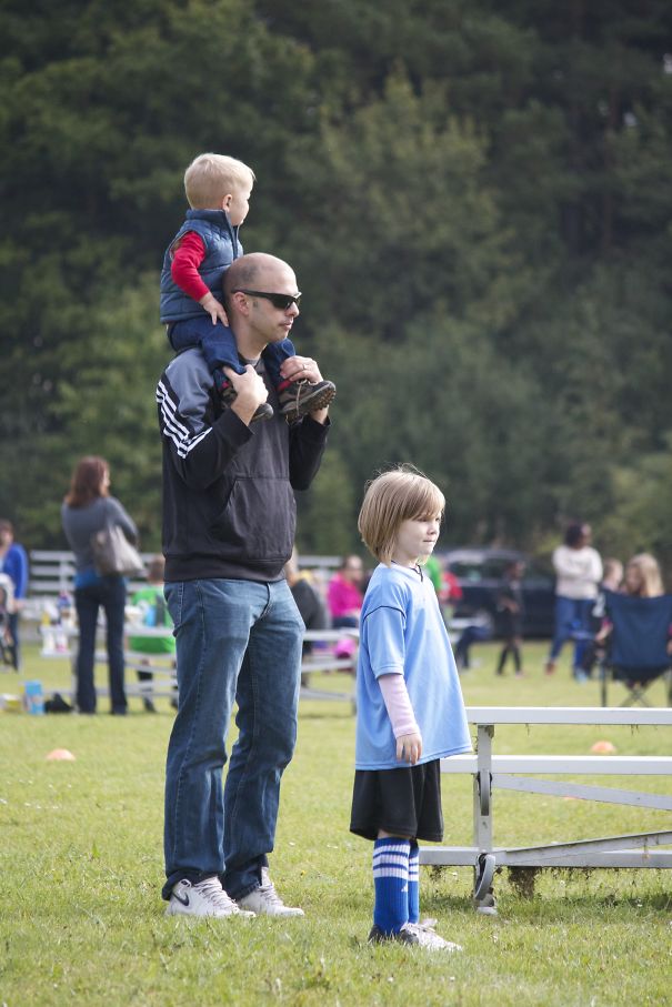 Encouraging His Daughter At A Soccer Game
