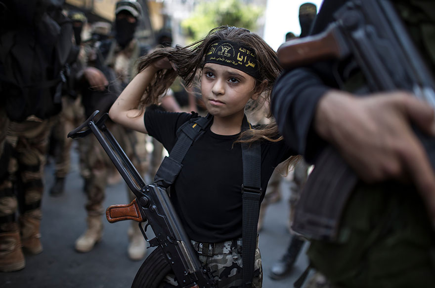 A Girl Holds A Rifle As Fighters Of Al-quds Brigades, The Military Wing Of Islamic Jihad, Gather In Gaza City