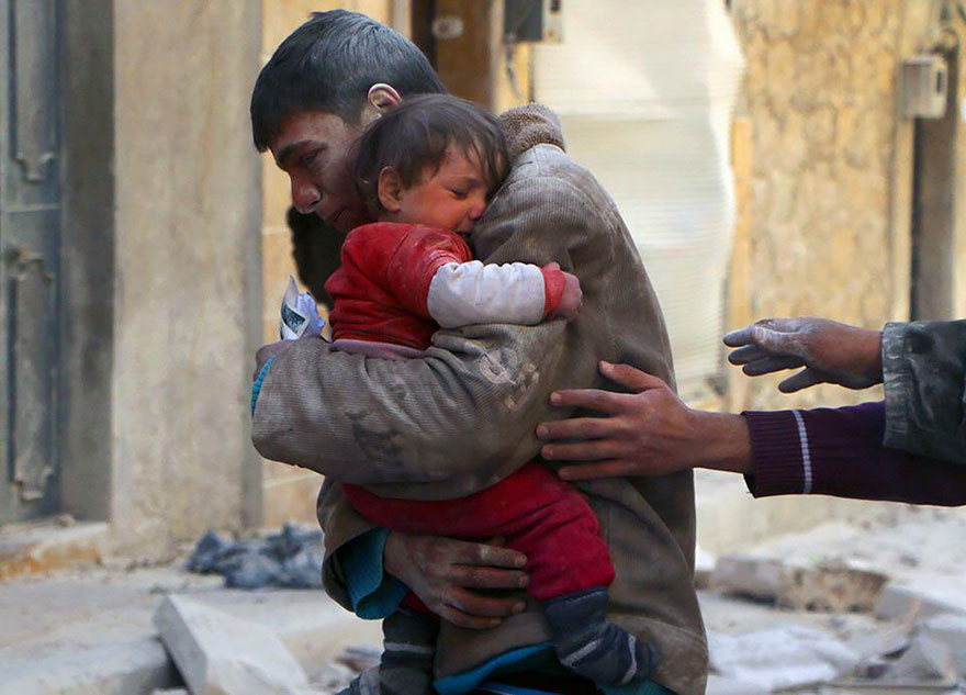 A Boy Rescues His Sister From Underneath The Rubble Of Their Home In Syria