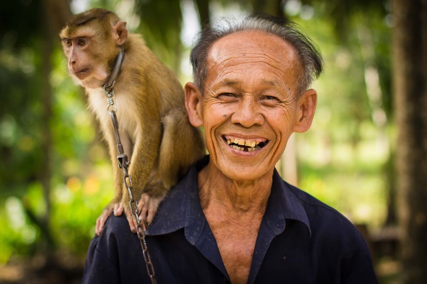 Old Thai Man With His Monkey