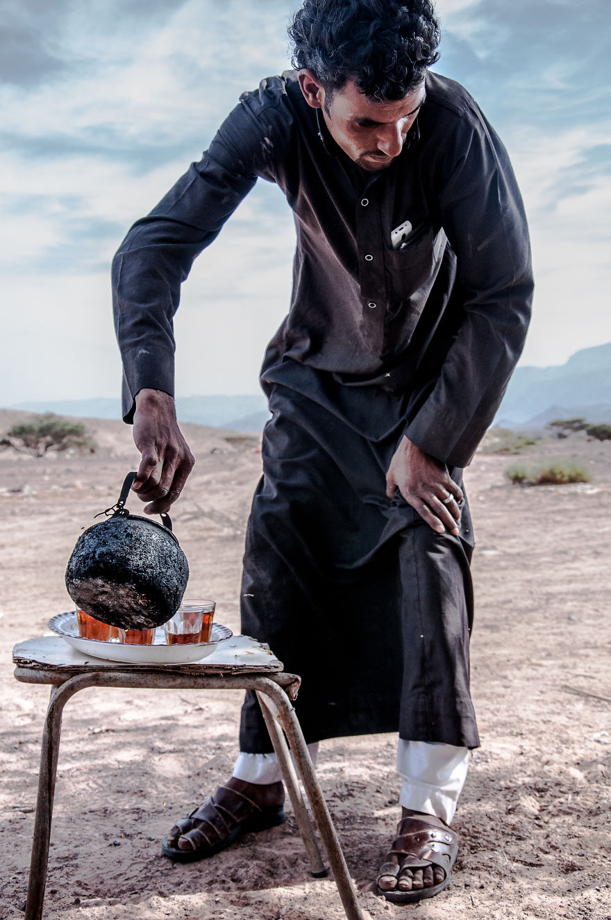 A Man Pouring Tea In The Middle Of Desert, Jordany,