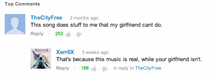 Two users exchanging a witty comeback in a comment thread discussing a song.