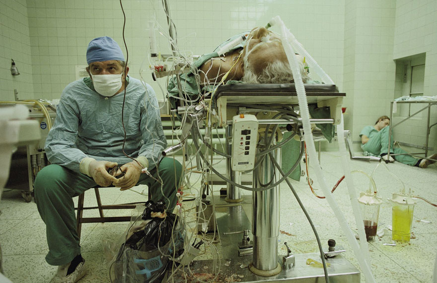 Heart Surgeon After 23-Hour-Long (Successful) Heart Transplant. His Assistant Is Sleeping