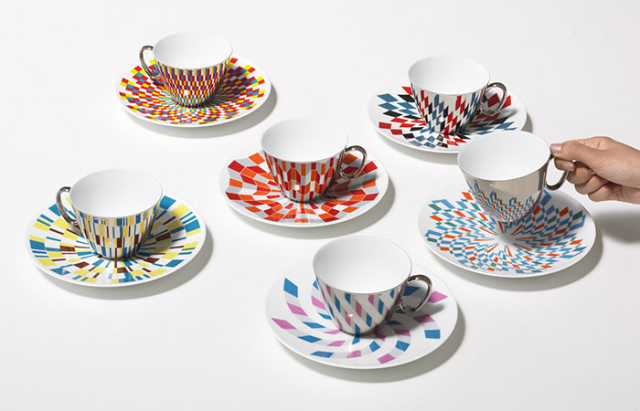 Mirror Teacups Reflect Colorful Patterns From The Saucers They’re Placed On