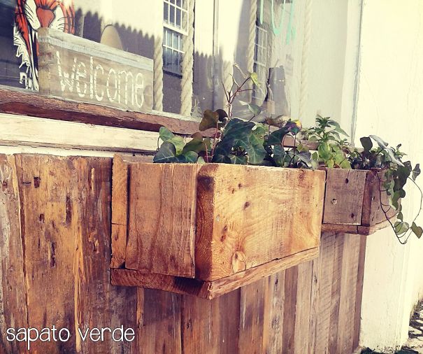 Flower Vase And Wall Made With Old Wood. Vegan Store In Cascais, Portugal