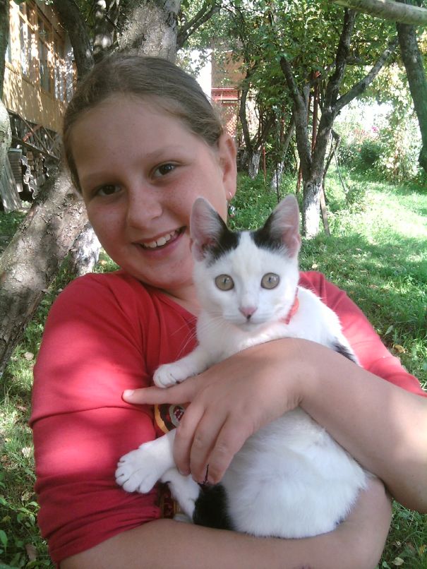 Happy Girl And Her Golden Eye Cat