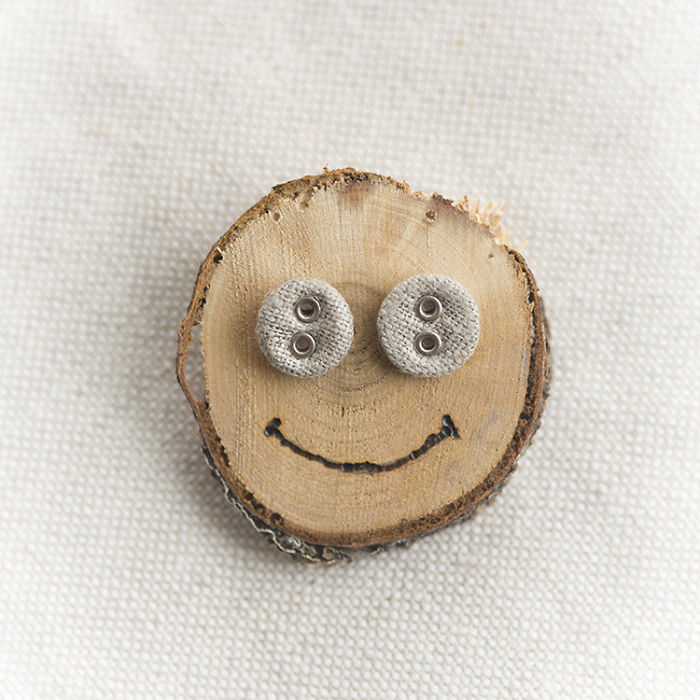 Linen Button Earrings On A Smiley Face