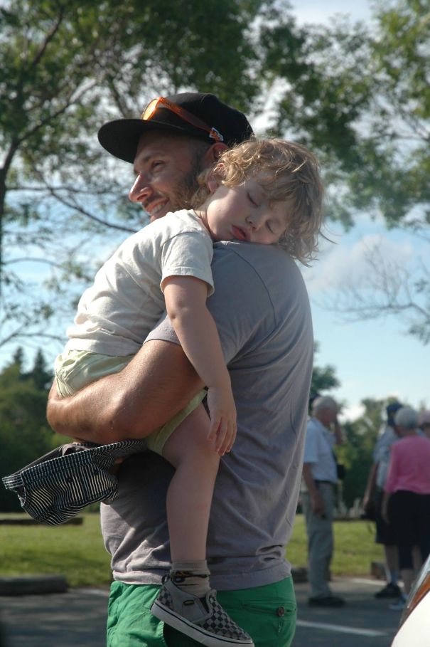 This Dad Carries His Napping Son Around While On Holidays.