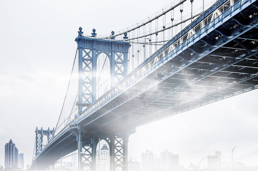 Fog Creeps Under The Manhattan Bridge, New York, New York