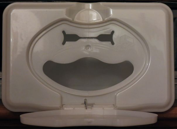 A Grinning Face (with A Little Hat) Found Under The Lid Of A Tub Of Baby Wipes