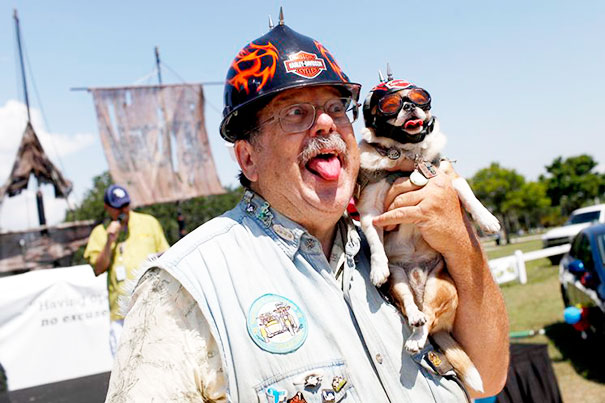 Owner Poses With His Dog During The Dog And Owner Look-Alike Contest
