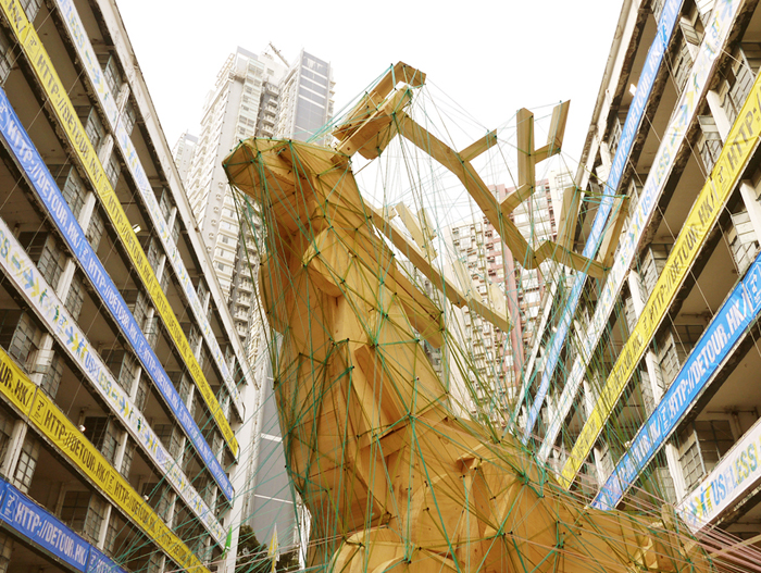 Weaving Forest: Visitors Use Yarn To Cover Recyclable Reindeer Installation