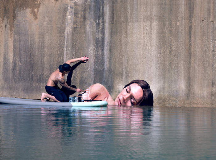 Artist Paints Stunning Seaside Murals While Balancing On A Surfboard