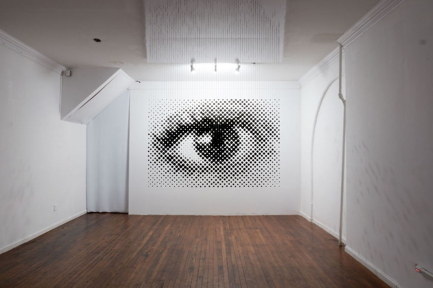 1,252 Floating Balls Form An Eye When Looking From The Right Angle