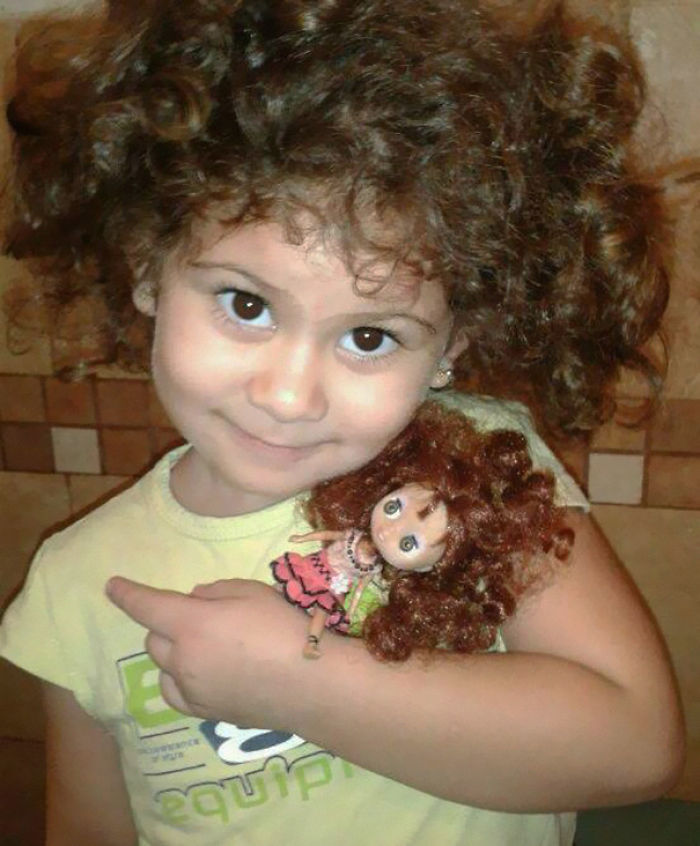 Girl With Her Look Alike Doll
