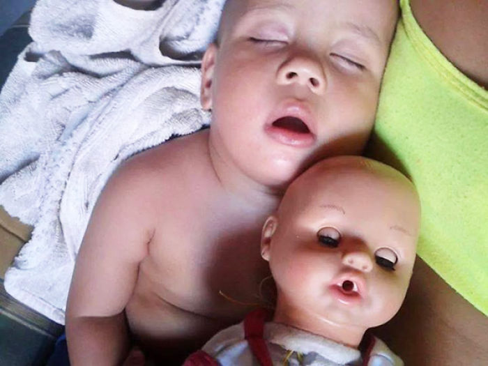 Baby With A Look Alike Doll